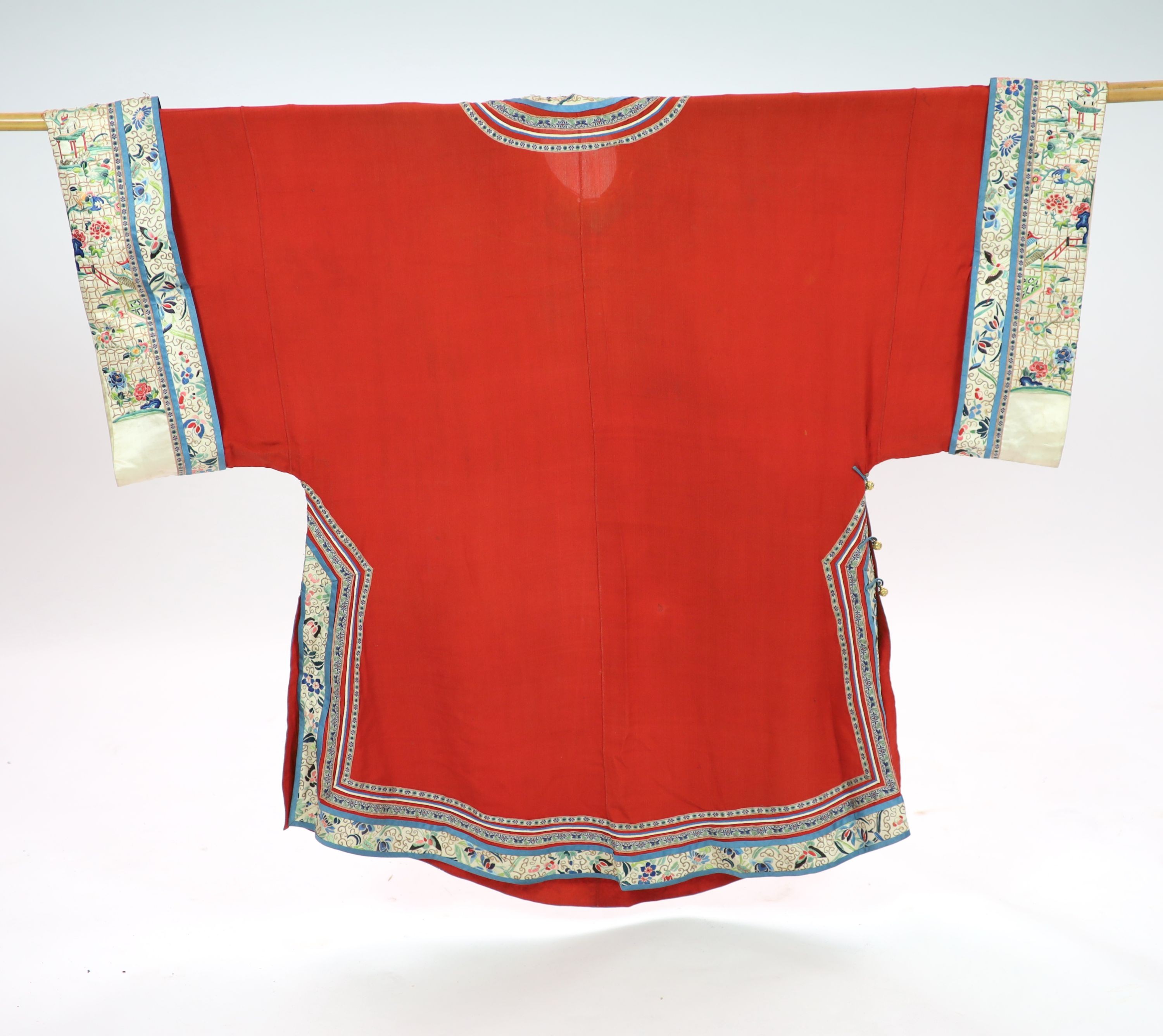 A Chinese red silk robe, late 19th century, 102cm drop